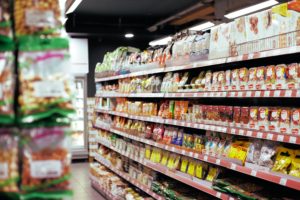 how to save money on groceries stocked shelves in a supermarket